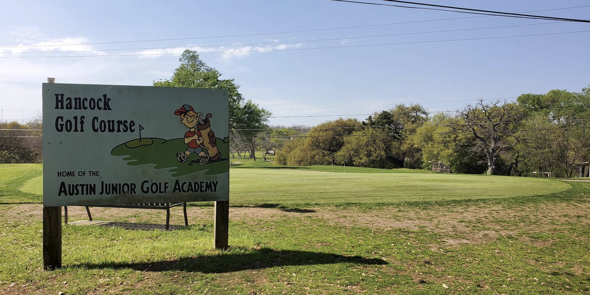 Photo of a sign that says Hancock Golf Course, hope of the Austin Junior Golf Academy